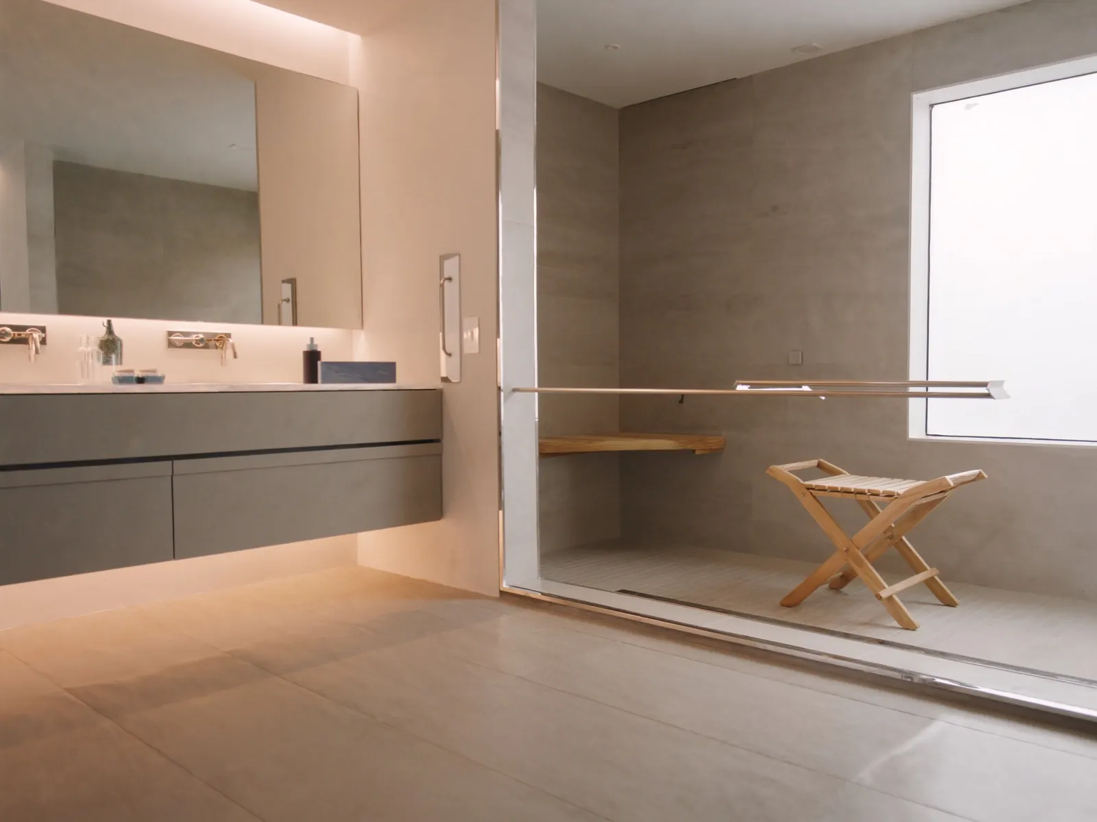 Barrier-free accessible bathroom with curbless shower and teak bench